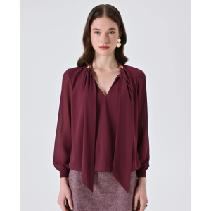 Blusa con fiocco e dettagli gold